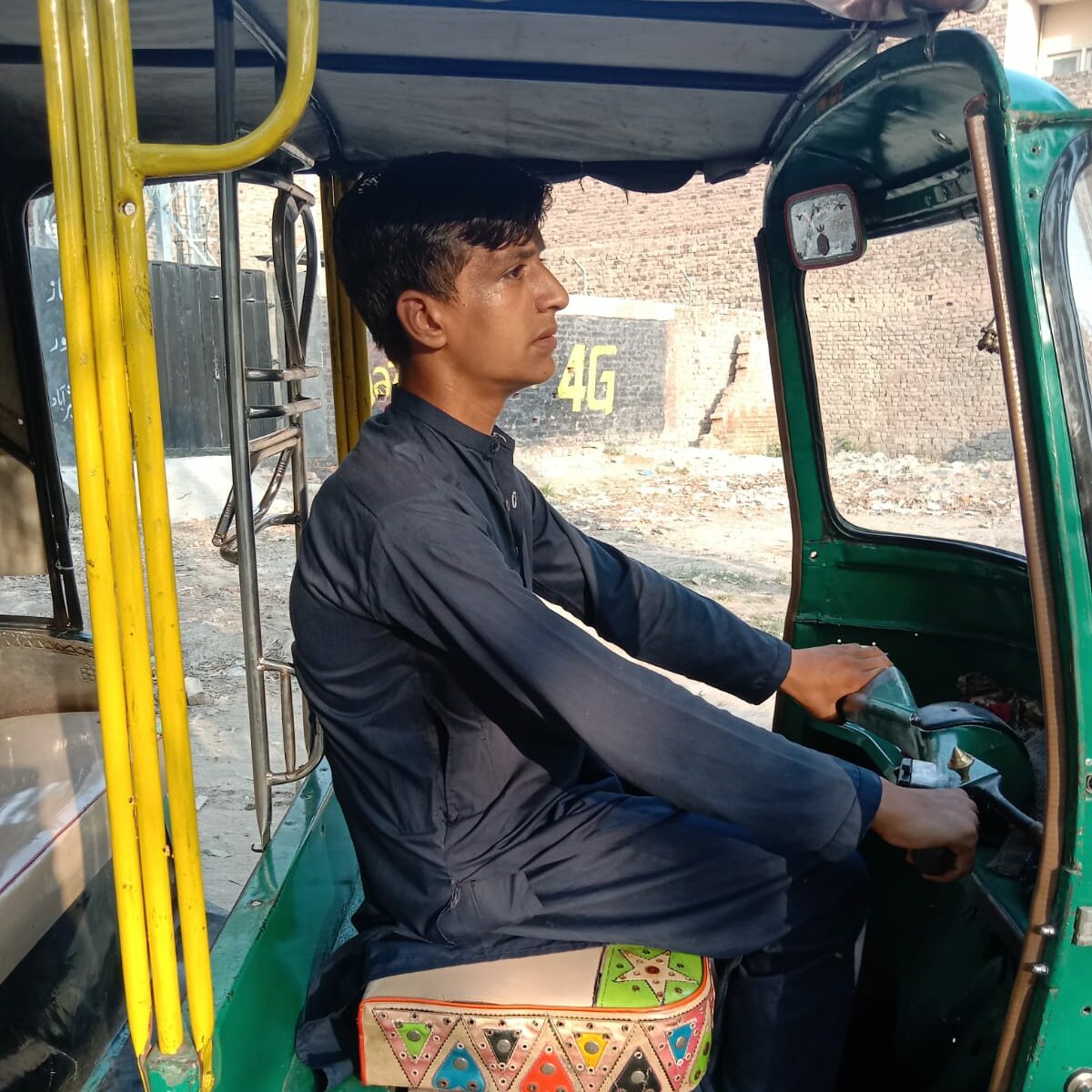 Muhammad Ali cruising in a Rickshaw